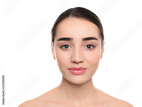 Portrait of young woman with beautiful face against white background