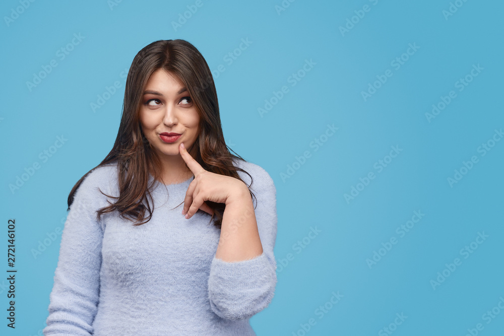 Thoughtful plus size female looking away Thoughtful plus size female looking away