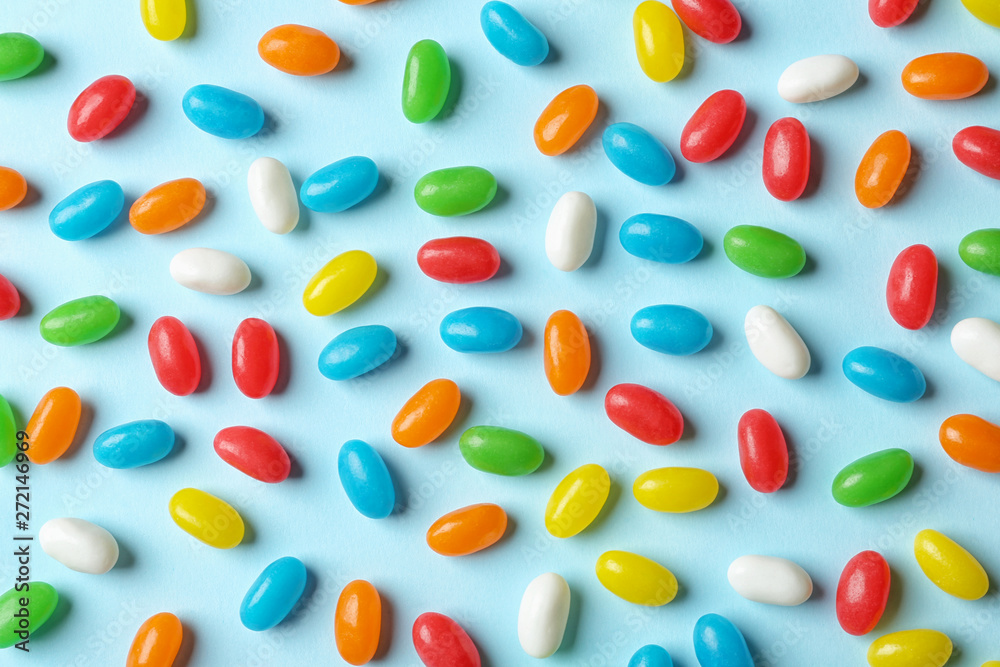 Flat lay composition with delicious jelly beans on color background Flat lay composition with delicious jelly beans on color background
