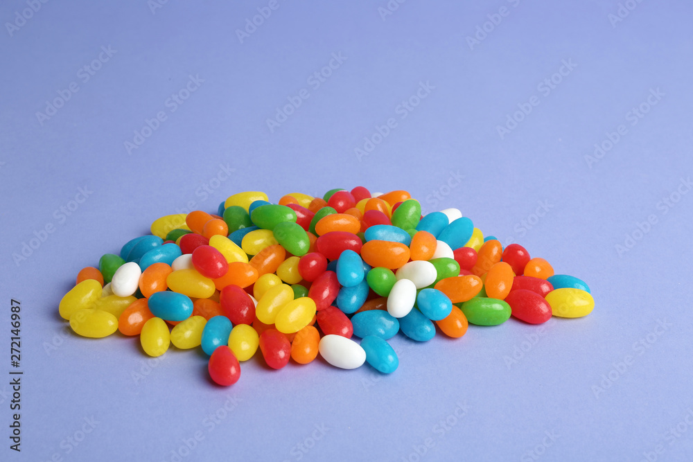 Delicious bright jelly beans on color background Delicious bright jelly beans on color background