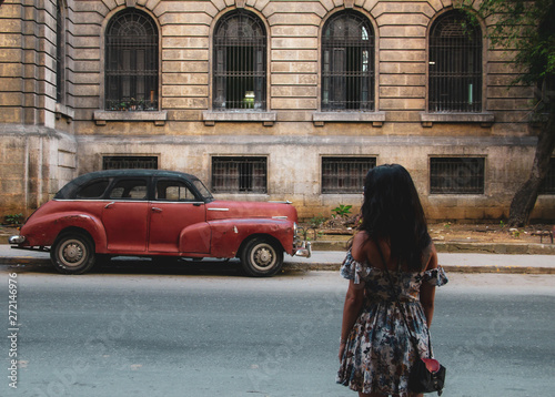 Colorful street and old car in Havana, Cuba photo