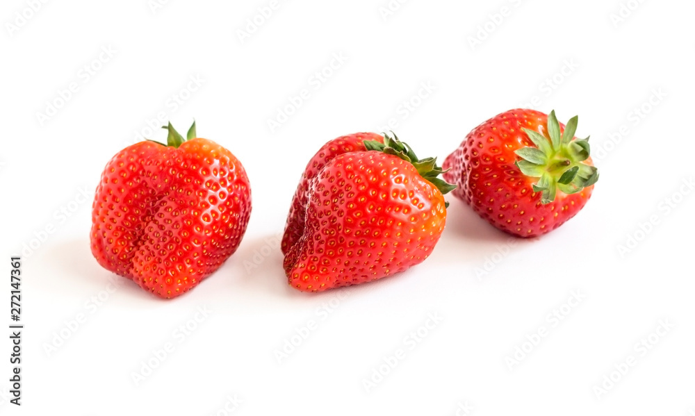 three large red ripe strawberries on white background three large red ripe strawberries on white background