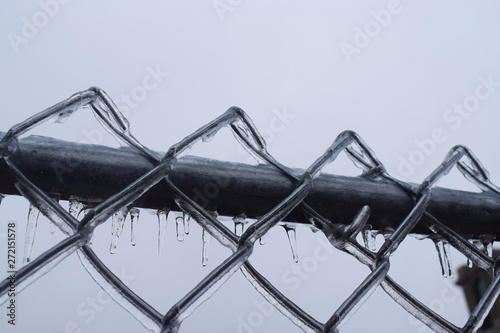 Area Boundary for safety with zikzak iron rope ornamented with ice after snowstorm photo