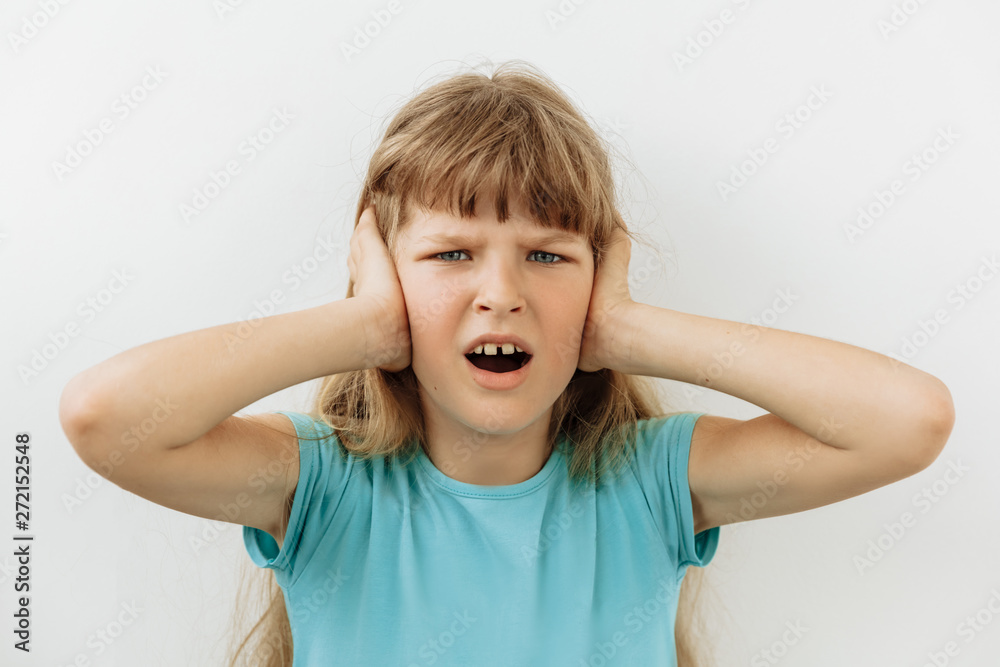 Frustrated and stress emotion. Portrait of 9 year girl against white background Frustrated and stress emotion. Portrait of 9 year girl against white background