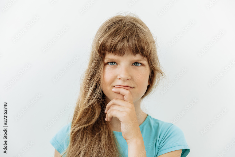 Thoughtful, thinking emotion concept. 9 year girl face portrait on white backgound. Thoughtful, thinking emotion concept. 9 year girl face portrait on white backgound.