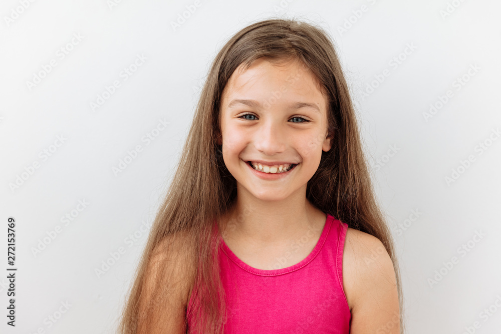 9 year girl portrait against white background. Laughter and joy emotions 9 year girl portrait against white background. Laughter and joy emotions