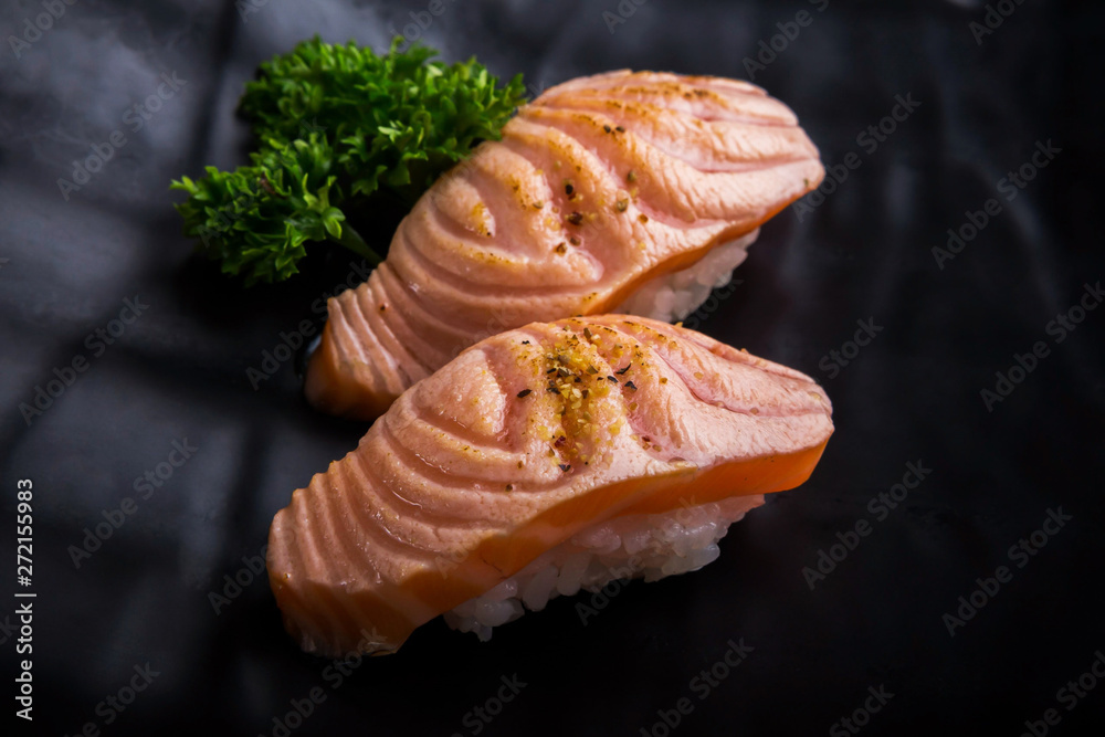 Creative Japanese food menu,sushi Simon Grill.On a black ceramic plate