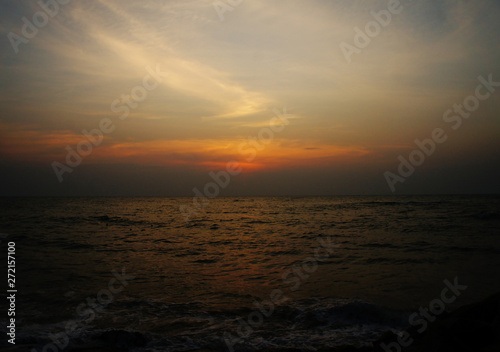Bright contrast saturated sunset on the ocean on the southern tropical coast. © Payllik