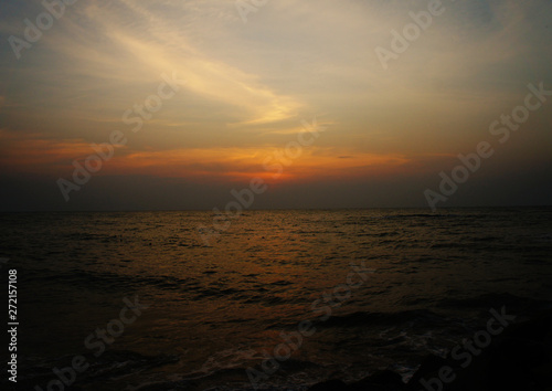 Bright contrast saturated sunset on the ocean on the southern tropical coast. © Payllik