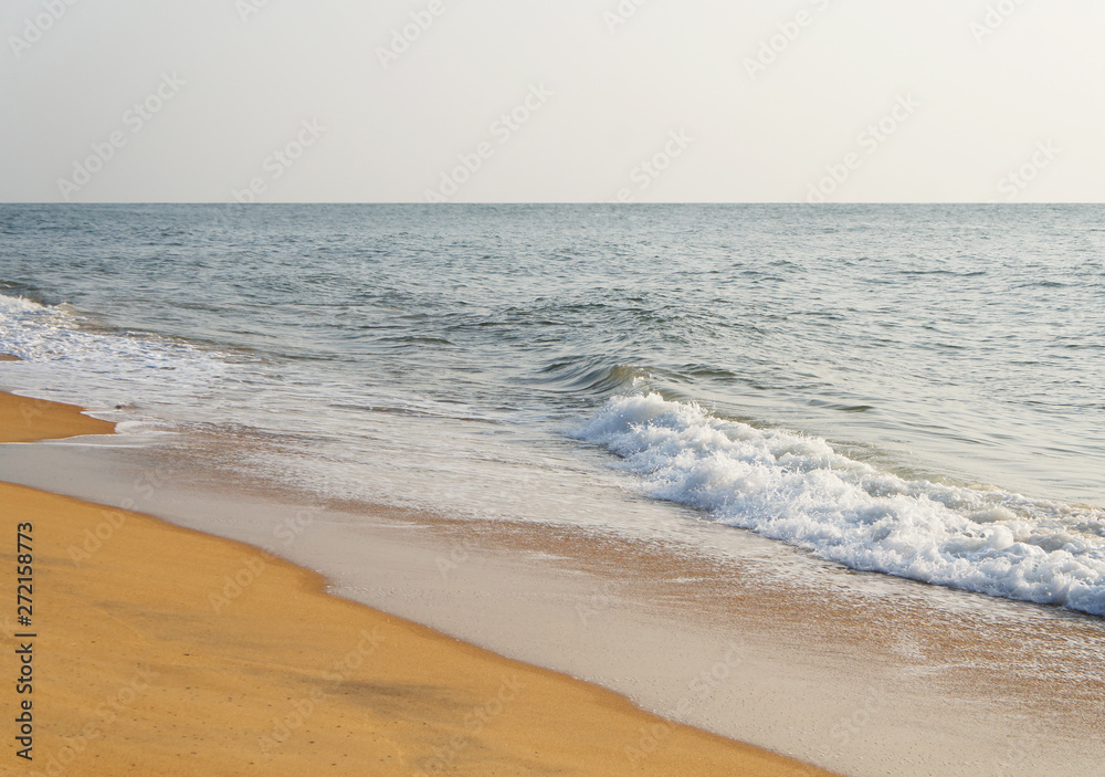 Sunny sandy coast on the ocean on the southern tropical island of Sri Lanka.