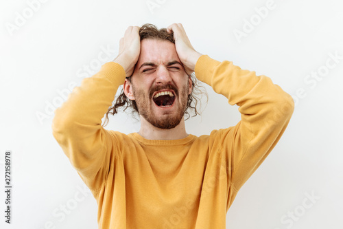 Furious, Frustrated and stress emotion. Portrait of bearded man against white background