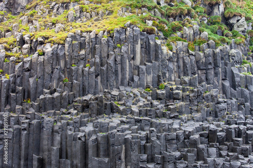 Black basalt columns of Reynisfjara look like huge pencils, a world-famous black-sand beach found on the South Coast of Iceland.