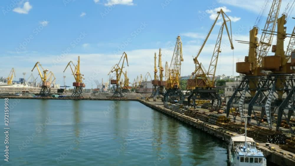 Marine port cranes, and industrial zone in cargo front of Odessa sea commercial port in Ukraine. Logistic freight center. Marine port cranes, and industrial zone in cargo front of Odessa sea commercial port in Ukraine. Logistic freight center.
