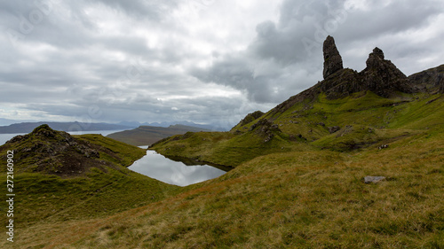 The Old Man of Storr is probably one of the most famous attractions in Isle of Skye. The hill presents a steep rocky eastern face overlooking the Sound of Raasay. photo