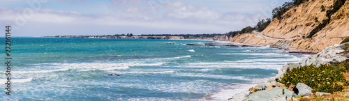 The dramatic Pacific Ocean coastline close to Santa Cruz, California; the scenic Highway 1 and eroded cliffs visible on the right