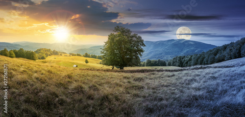 day and night time change concept above the beech tree on the meadow in mountains. landscape with sun and moon. wonderful summer scenery of carpathian countryside. mountain ridge in the distance.