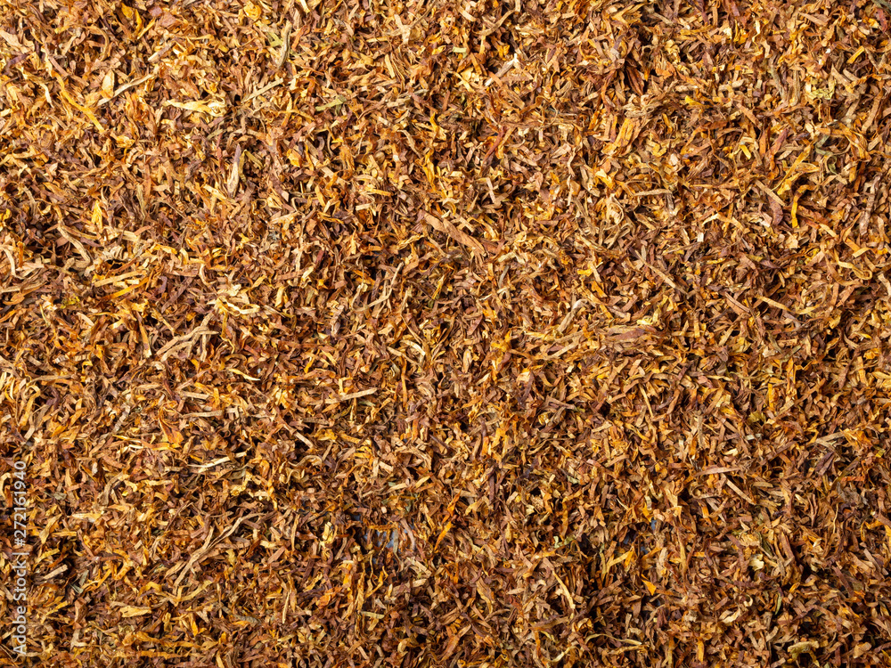 Tobacco texture. High quality dry cut tobacco big leaf, close up, background