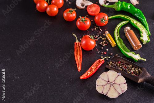 Ingredients for preparation of tasty Italian pizza. Cherry tomato, spices, basil, chili pepper