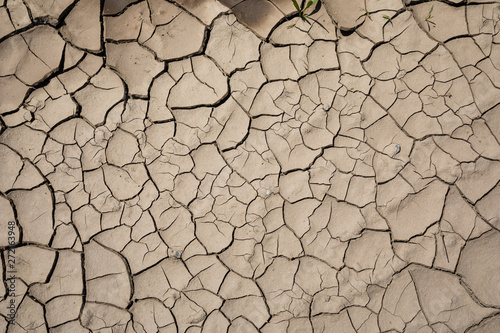 Detail of a cracked dry soil in water shortage time