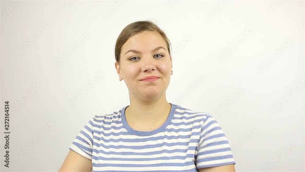 A young beautiful woman applauds with admiration. white background A young beautiful woman applauds with admiration. white background