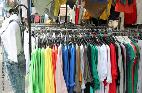 stand of clothes at outdoor market