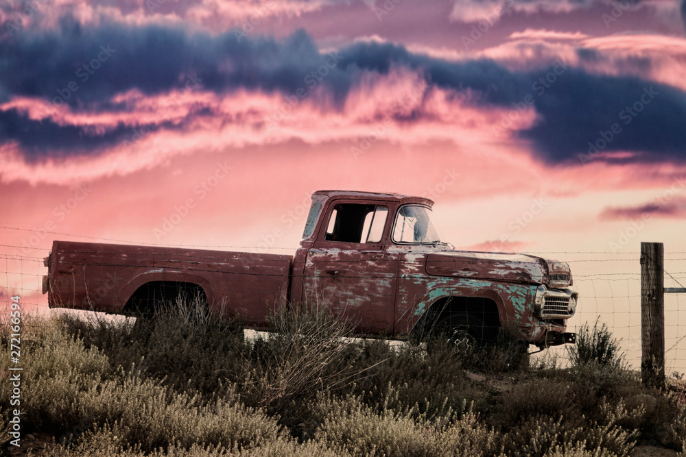 vintage pickup truck on a meadow at sunset - obrazy, fototapety, plakaty 