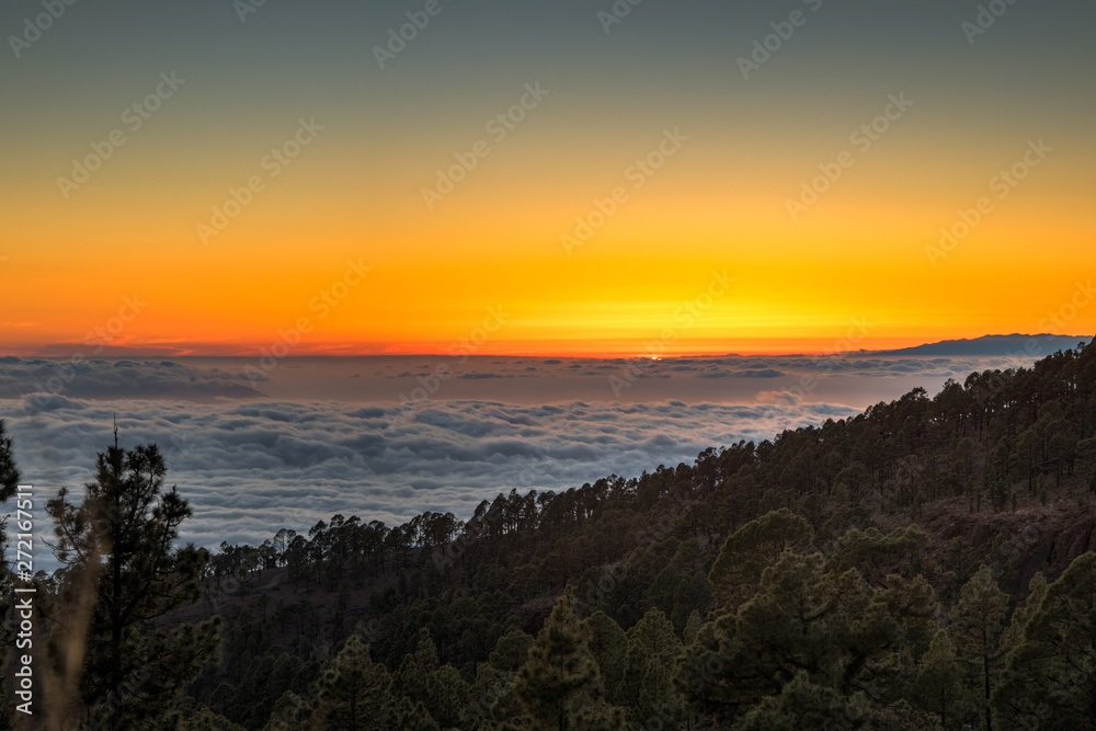 magical sunset above the clouds in the Tenerife mountains in Canary Islands