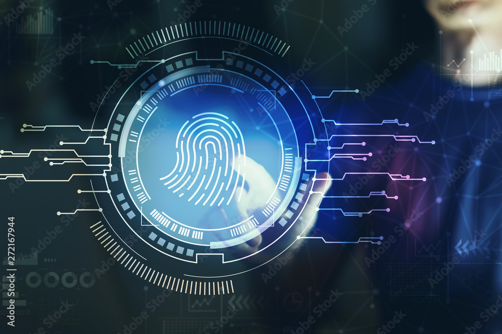 Fingerprint scanning theme with young man pointing on a dark background