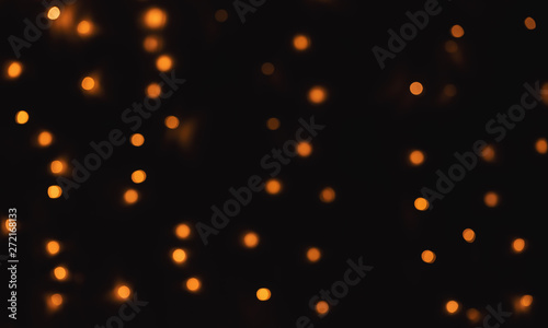 Abstract blurred shiny bokeh lights black background