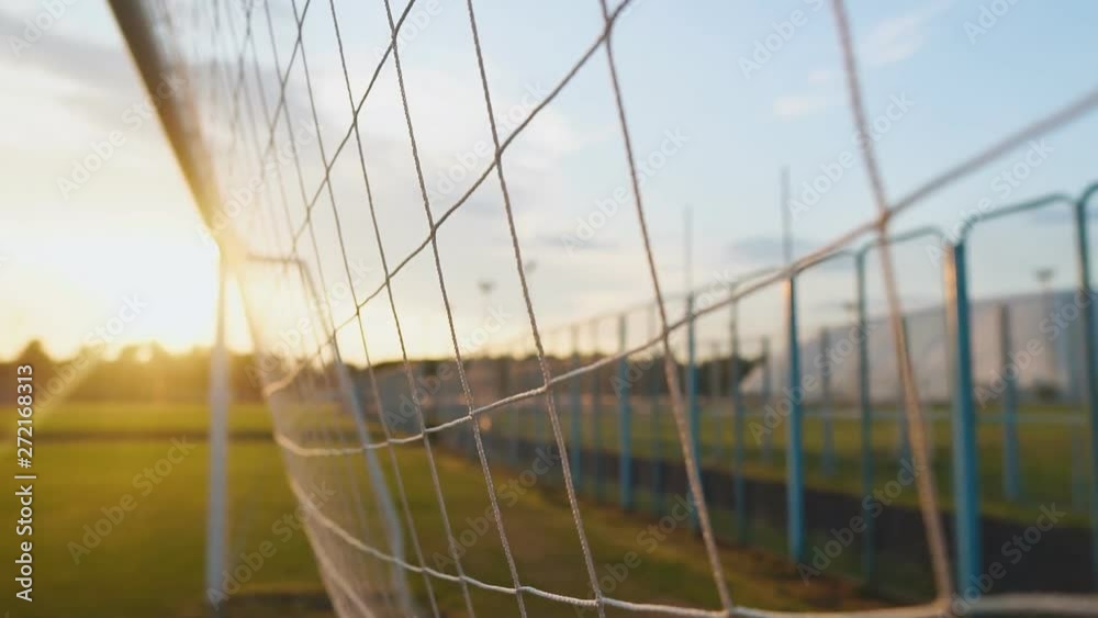 Close up of soccer or football net at sunset