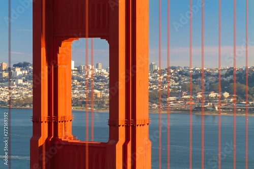Golden Gate Bridge close-up with San Francisco skyline in background