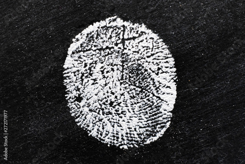 macro shot of persons fingerprint, evidence in a crime case, white and black colorss photo