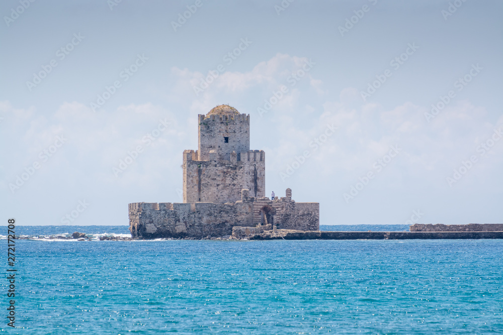 Old tower in fort and historical castle in ancient picturesque town Methoni on Peloponnese, Greece, tourist destination