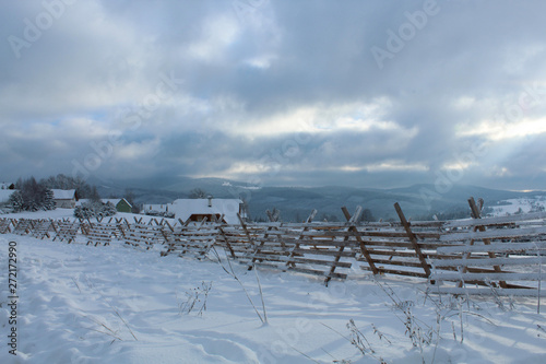 winter landscape with fence and blue sky