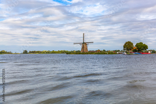 Old Dutch traditional windmill located at Rottemeren photo