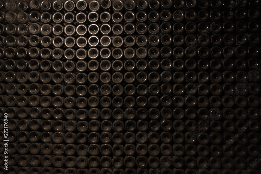 Wall of wine bottles at winery