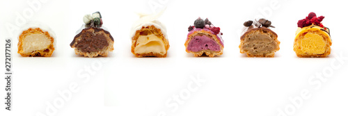 Принти на полотні Delicious eclairs in a cut with various fillings and design isolate on a white b