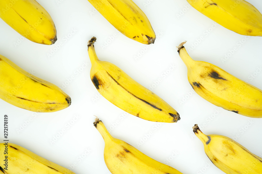 patten rows of ripe bananas on a white background patten rows of ripe bananas on a white background