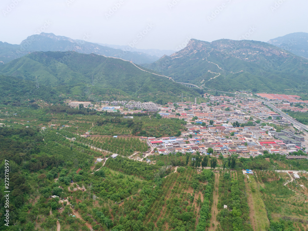 Aerial view  top view of small village with little courtyard and farm style house in the country side area of Huaibei next the mountain, China