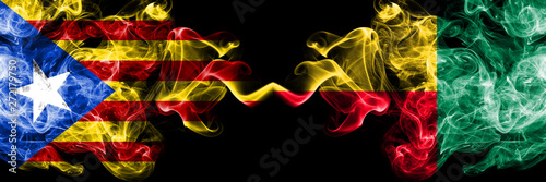 Catalonia vs Benin  Beninese smoke flags placed side by side. Thick colored silky smoke flags of Catalonia and Benin  Beninese