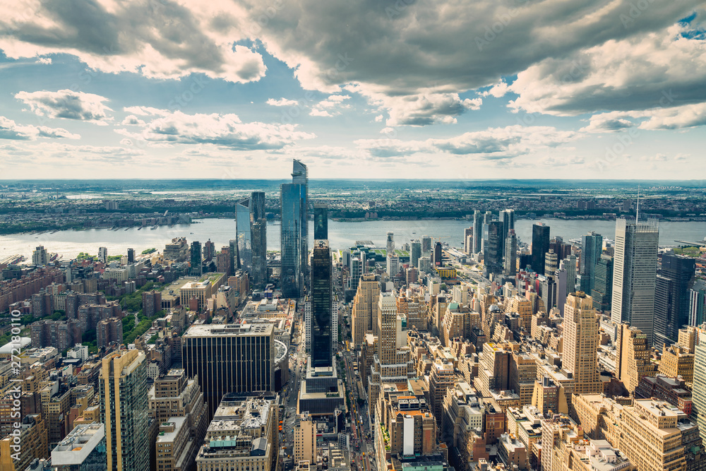 New York City Skyline Aerial View with Dramatic Cloudy Sky in Background
