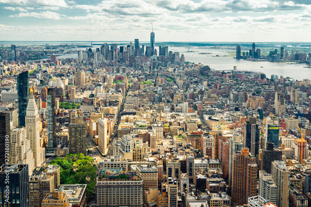 Obraz premium New York City Skyline Aerial View. Hudson River and East River, Ocean and Cloudy Blue Sky on a Horizon