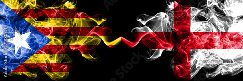 Catalonia vs England  English smoke flags placed side by side. Thick colored silky smoke flags of Catalonia and England  English