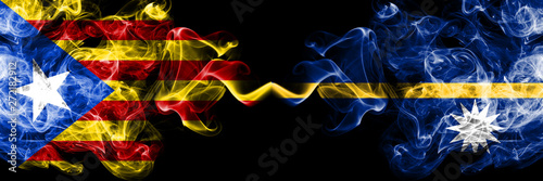 Catalonia vs Nauru smoke flags placed side by side. Thick colored silky smoke flags of Catalonia and Nauru