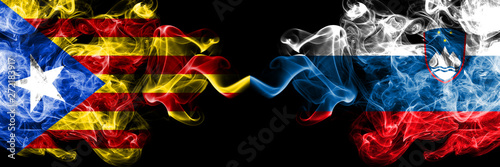 Catalonia vs Slovenia  Slovenian smoke flags placed side by side. Thick colored silky smoke flags of Catalonia and Slovenia  Slovenian