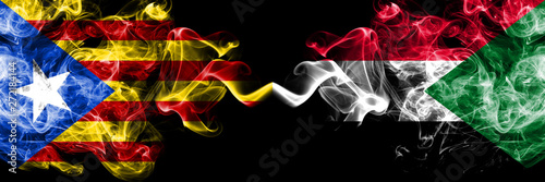 Catalonia vs Sudan  Sudanese smoke flags placed side by side. Thick colored silky smoke flags of Catalonia and Sudan  Sudanese