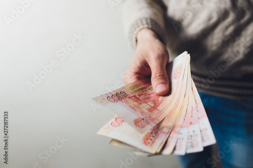 Russian rubles banknotes in a man's hand. photo