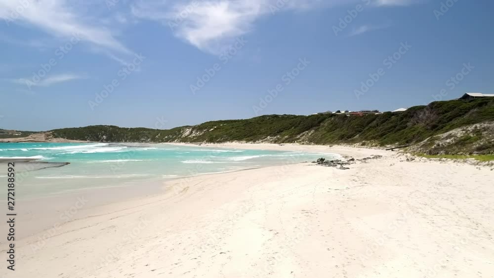 Lockdown: Light Blue Ocean Waves Crashing On Sandy Shore By Hills, Bright Blue Sky - Esperance, Australia Lockdown: Light Blue Ocean Waves Crashing On Sandy Shore By Hills, Bright Blue Sky - Esperance, Australia