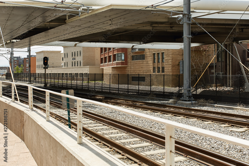 Train tracks near Union Station and the Millennium Bridge in the Riverfront Park neighborhood of Denver, Colorado	