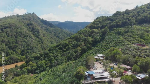 Footage of Beautiful Rural landscape scene with clear blue sky at small town TENOM, SABAH, MALAYSIA photo